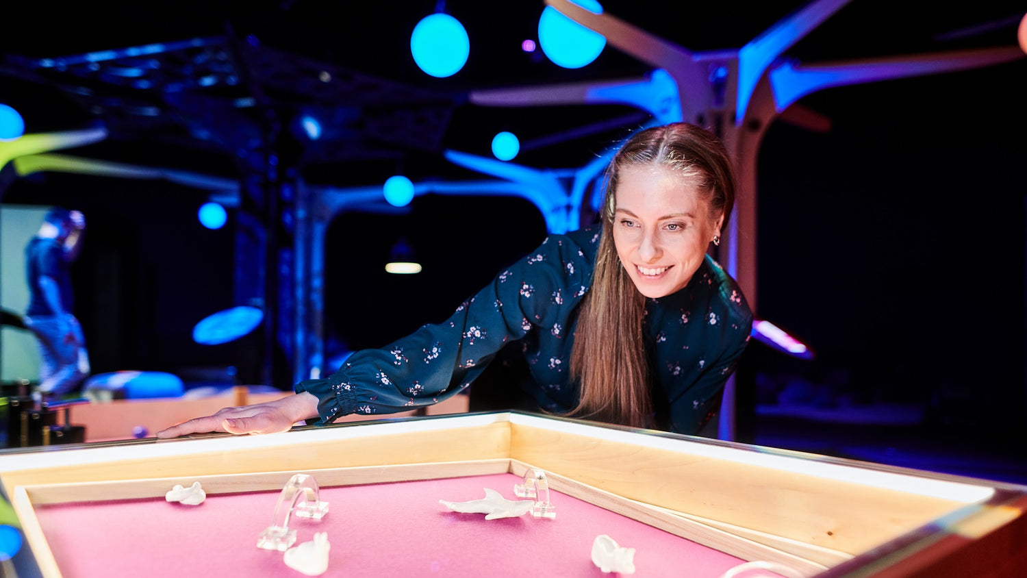 A woman explores Heureka’s Power of Play exhibition’s details.